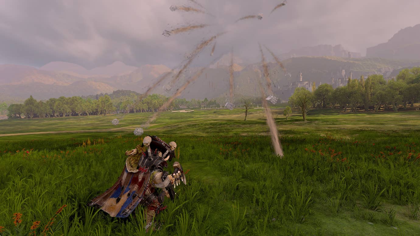 Pelting a big orc with big rocks in Total War: Warhammer III.